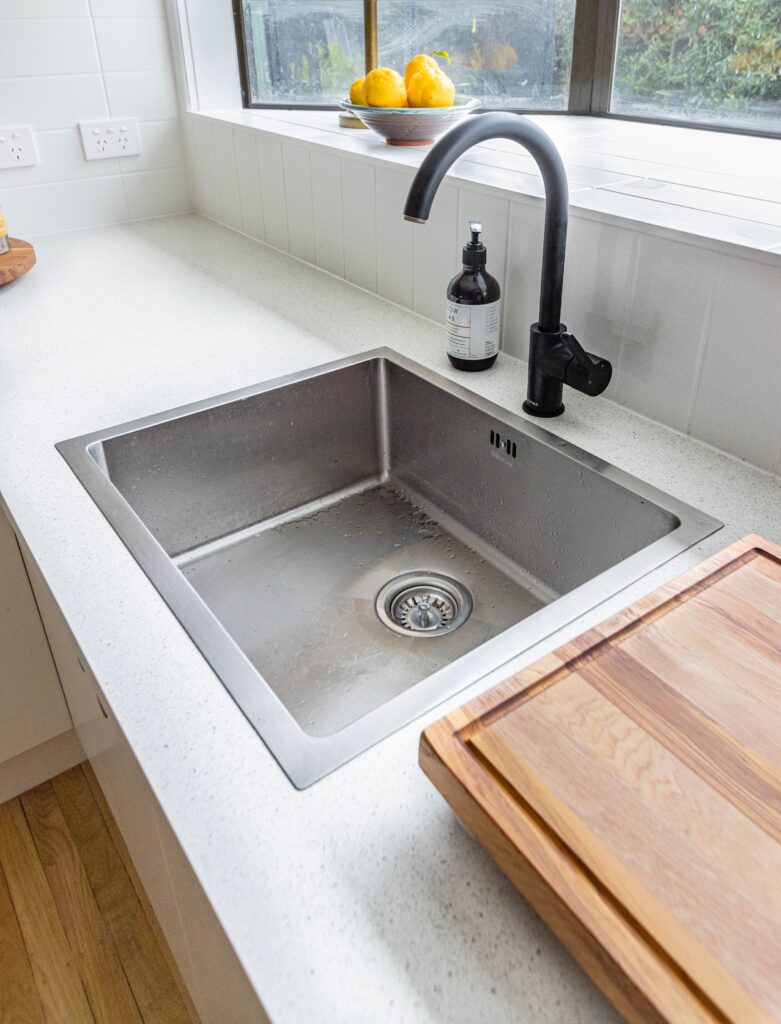 Photo of a kitchen sink by Callum Hill on Unsplash